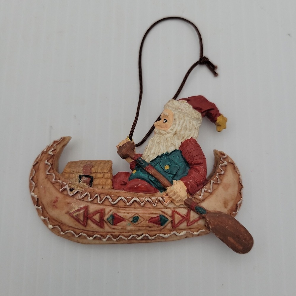 Kurt Adler Santa Claus Paddling Canoe Folk Art Christmas Ornament Resin Vintage